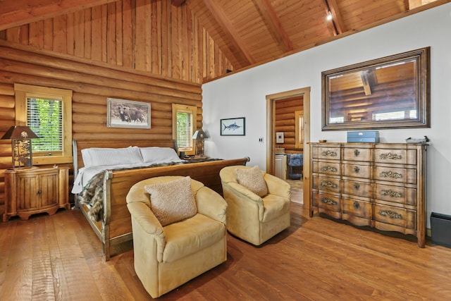 bedroom featuring high vaulted ceiling, beam ceiling, wood-type flooring, and wooden ceiling