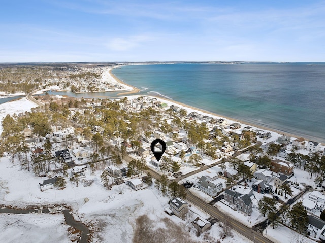 drone / aerial view featuring a water view and a view of the beach