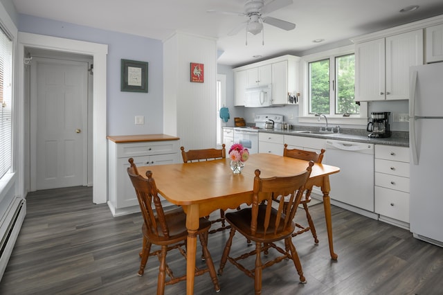 dining space with a baseboard heating unit, dark wood-style flooring, and a ceiling fan