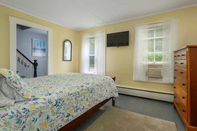 bedroom featuring multiple windows, ornamental molding, and baseboard heating