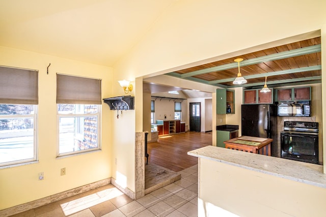 kitchen featuring baseboards, wooden ceiling, vaulted ceiling with beams, black appliances, and light tile patterned flooring