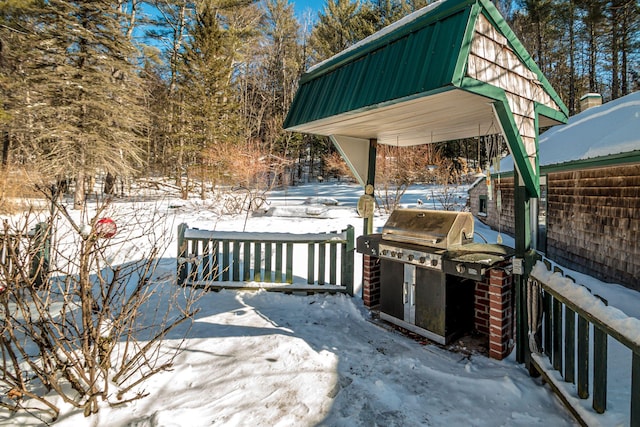 snow covered deck with grilling area