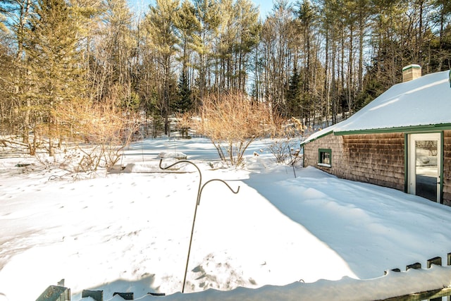 view of yard layered in snow