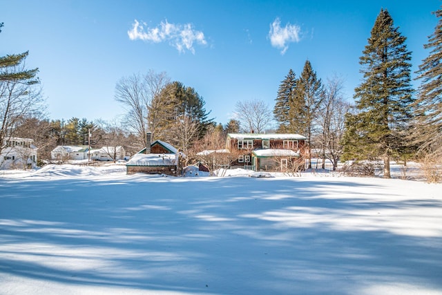 view of yard layered in snow