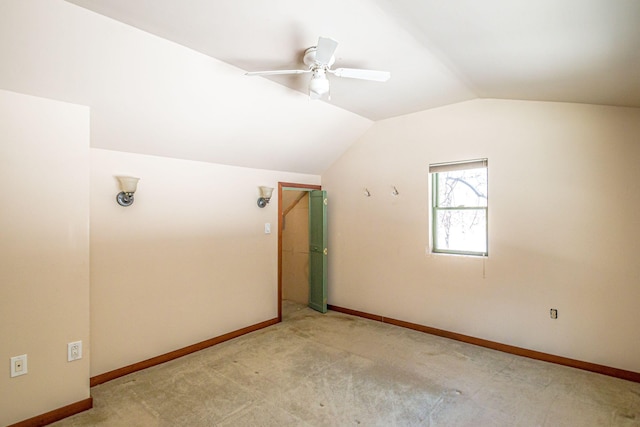 bonus room with vaulted ceiling, ceiling fan, carpet, and baseboards