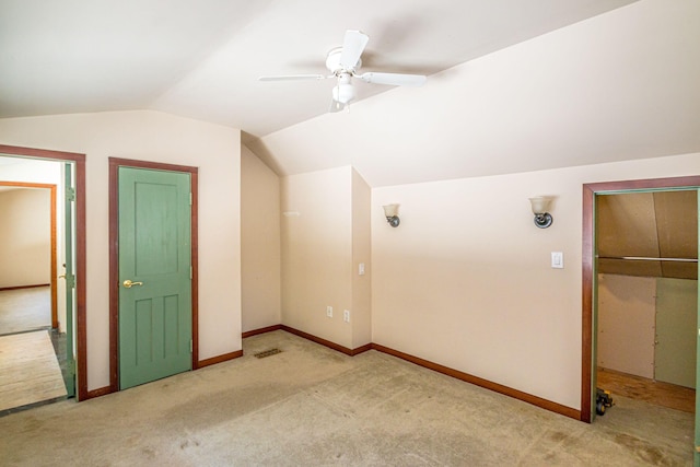 bonus room with lofted ceiling, visible vents, carpet floors, and baseboards