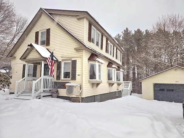 view of front of property featuring an outbuilding and ac unit