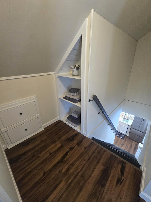 additional living space with lofted ceiling and wood finished floors