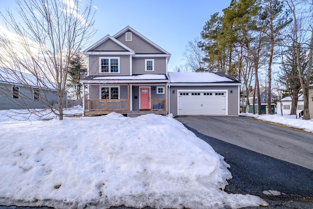 view of front facade featuring aphalt driveway, a porch, and an attached garage