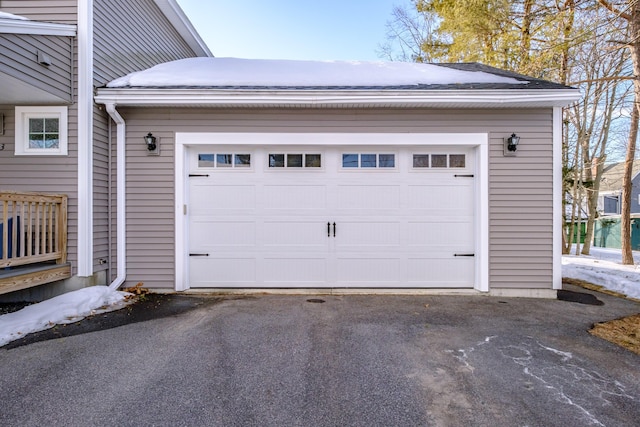 garage with aphalt driveway