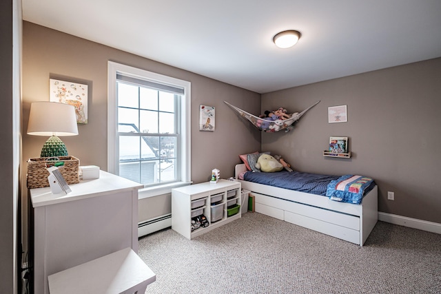 bedroom featuring baseboards, baseboard heating, and light colored carpet