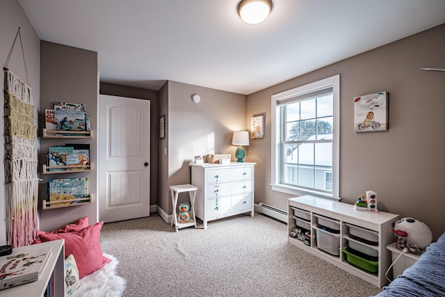 carpeted bedroom with a baseboard radiator and baseboards