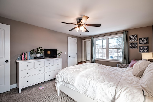 carpeted bedroom featuring ceiling fan and baseboards