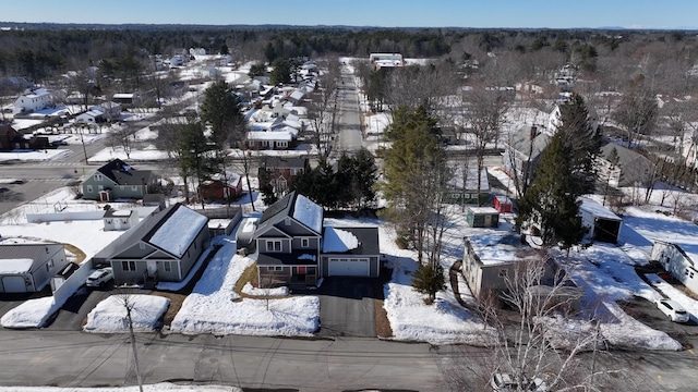 snowy aerial view featuring a residential view