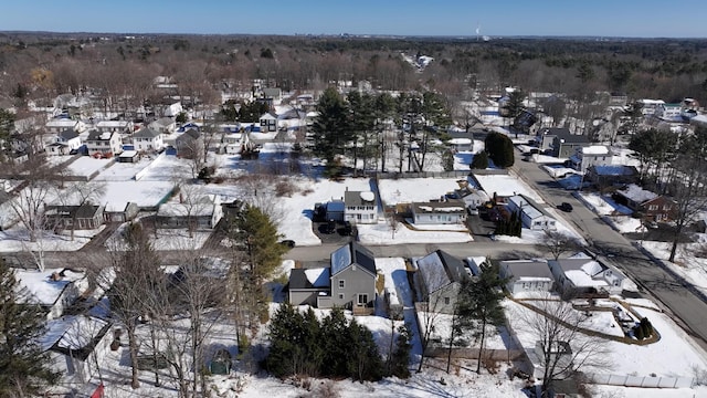 snowy aerial view featuring a residential view