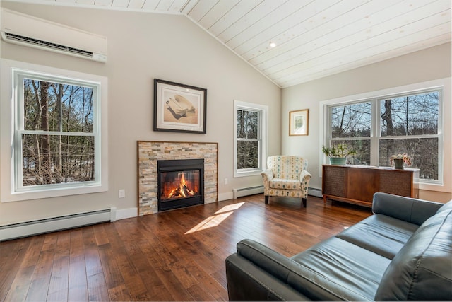 living area with lofted ceiling, baseboard heating, an AC wall unit, and hardwood / wood-style floors