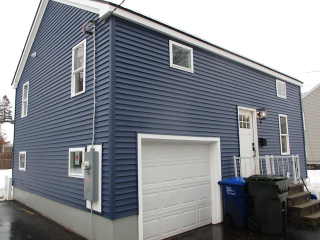 view of side of property with a garage