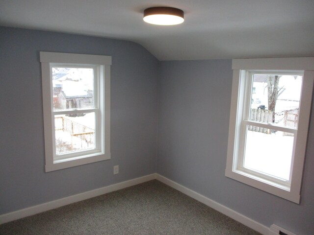 bonus room with lofted ceiling, carpet floors, a baseboard heating unit, and baseboards