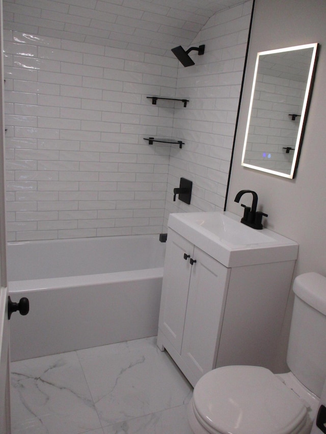 bathroom featuring marble finish floor, shower / bathing tub combination, vanity, and toilet