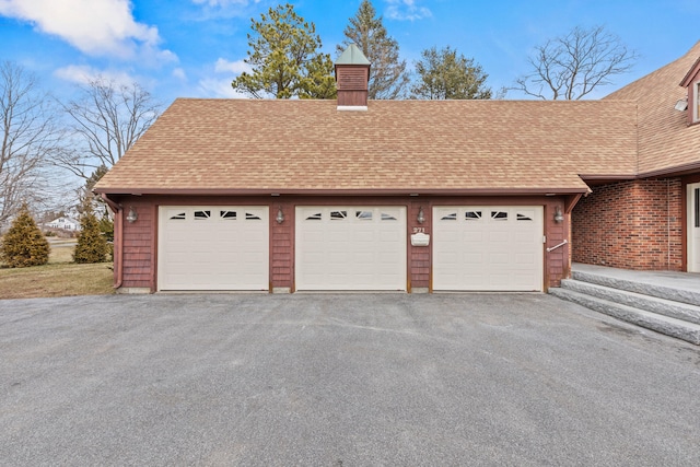 garage featuring driveway