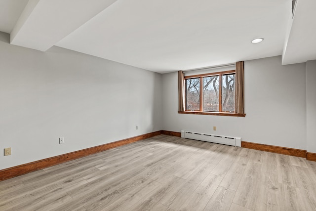 unfurnished room featuring a baseboard radiator, wood finished floors, baseboards, and recessed lighting