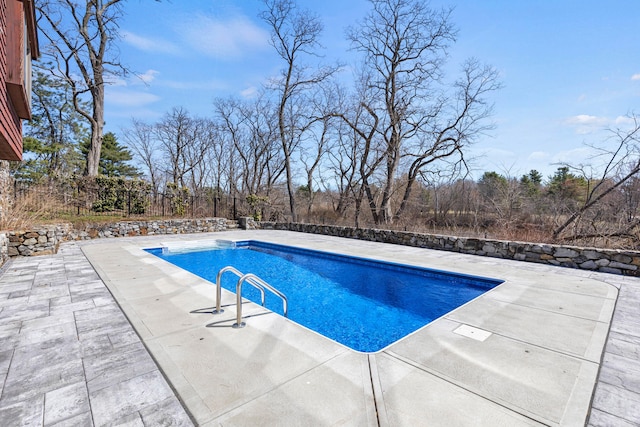 view of swimming pool featuring a fenced backyard, a patio area, and a fenced in pool