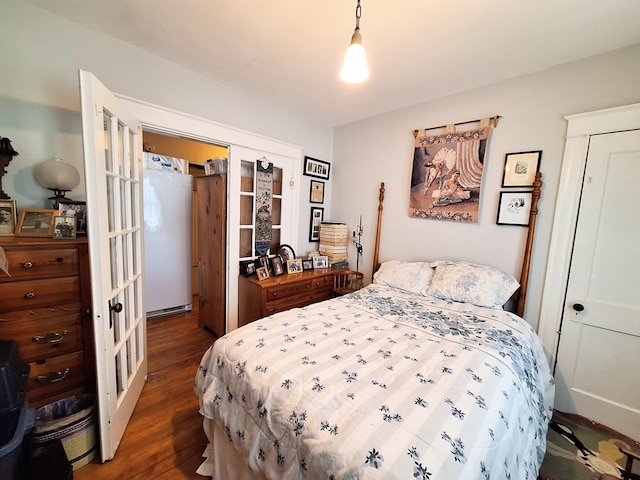 bedroom featuring dark wood-style flooring