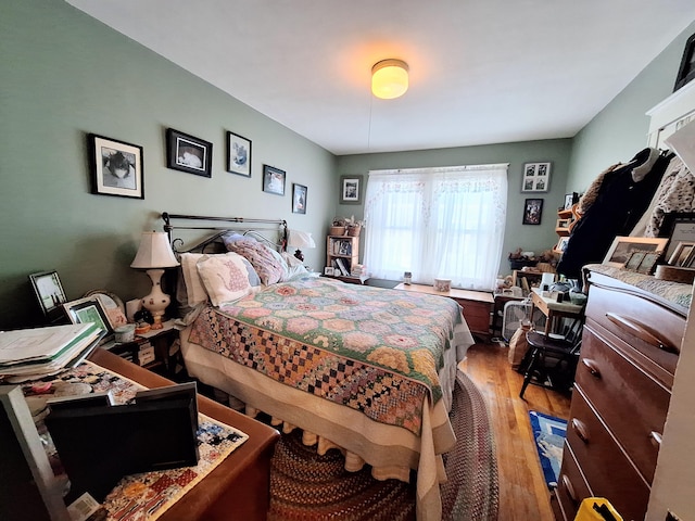 bedroom with wood finished floors