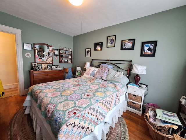 bedroom with wood finished floors