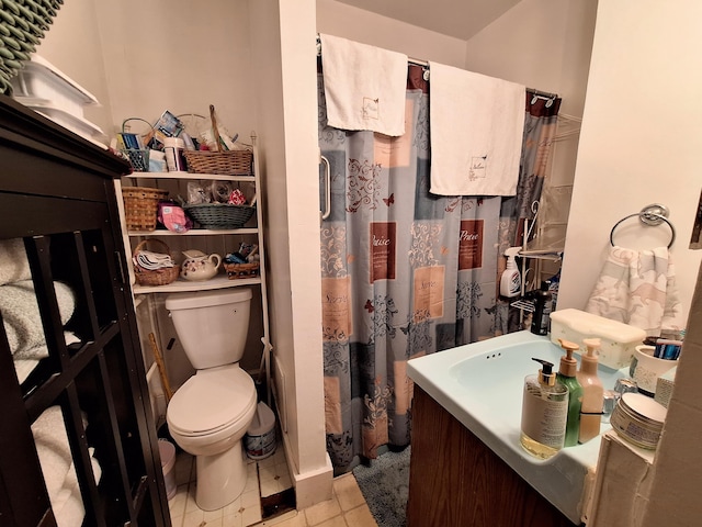 bathroom with tile patterned floors, toilet, and a shower with curtain