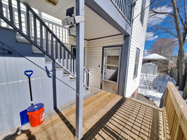 wooden deck featuring stairway