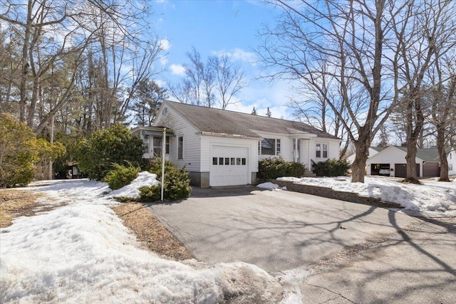 view of front of property with a garage and driveway