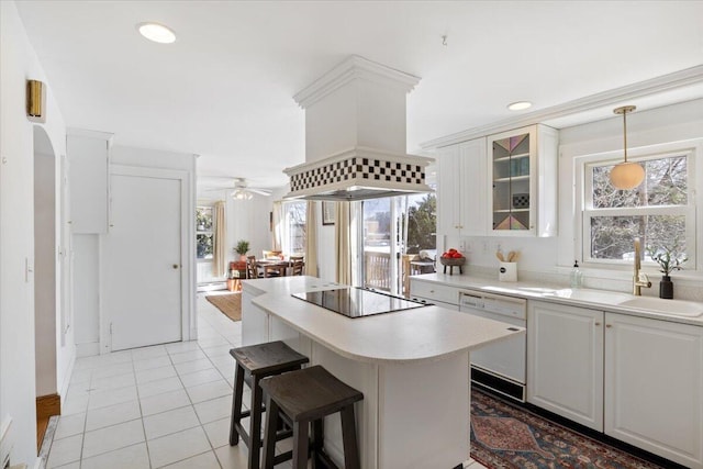 kitchen with light tile patterned flooring, white dishwasher, a sink, premium range hood, and black electric cooktop