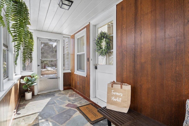 sunroom / solarium featuring wooden ceiling