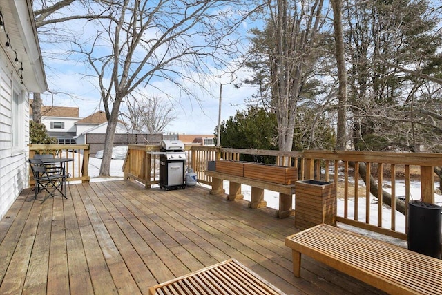 wooden deck featuring area for grilling