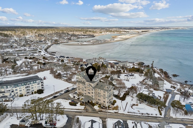 bird's eye view with a water view and a beach view