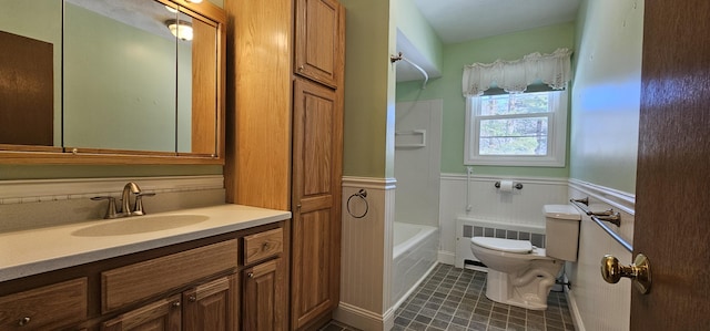 full bath with tile patterned flooring, toilet, a wainscoted wall, vanity, and radiator