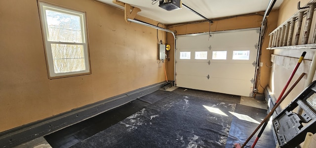 garage featuring a garage door opener and electric panel