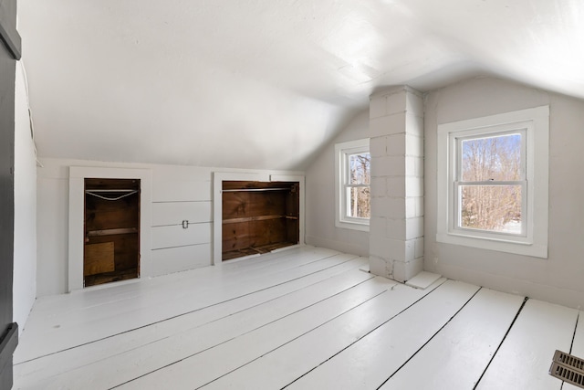 bonus room featuring vaulted ceiling