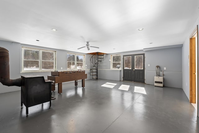 rec room featuring a ceiling fan, recessed lighting, and concrete flooring