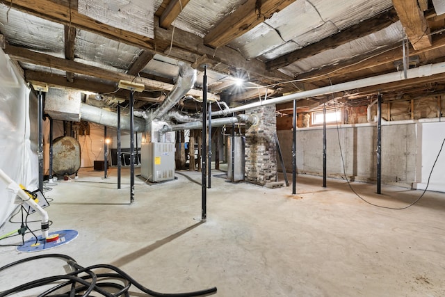 basement featuring heating unit and heating fuel