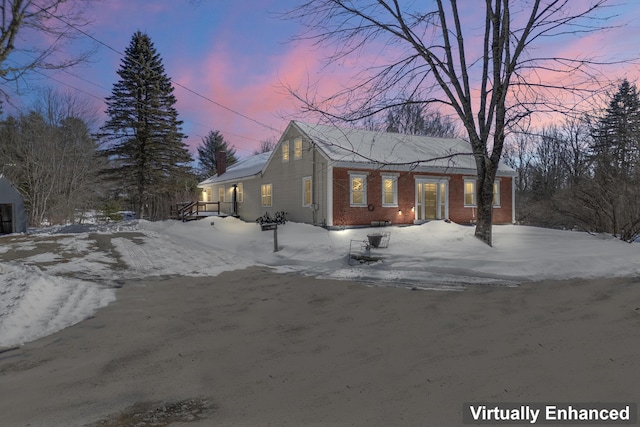 view of front of house with brick siding and driveway