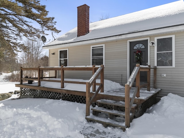 view of snow covered deck