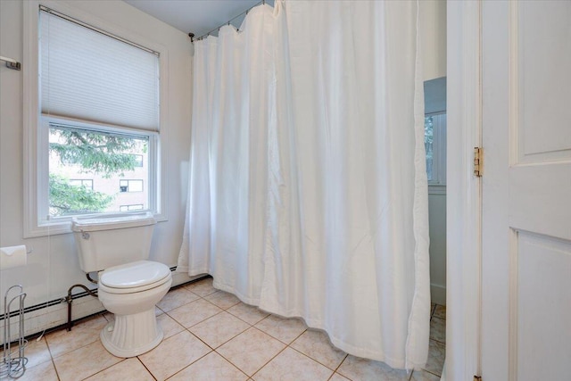 full bath featuring toilet, tile patterned flooring, and a baseboard heating unit