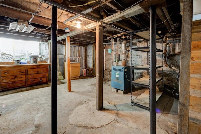 unfinished basement featuring a heating unit