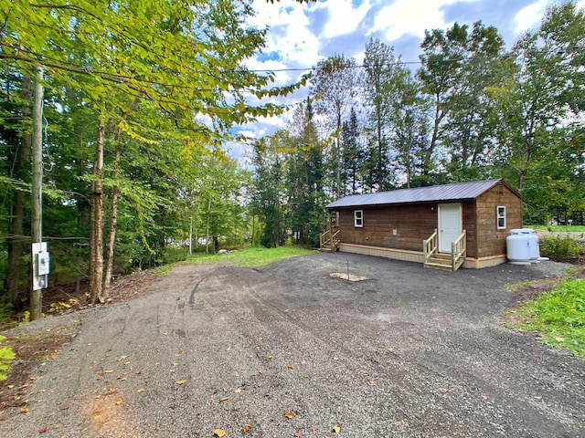 exterior space featuring entry steps and driveway