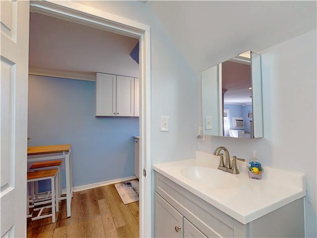 bathroom featuring wood finished floors and vanity