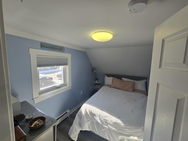 bedroom featuring lofted ceiling and baseboard heating