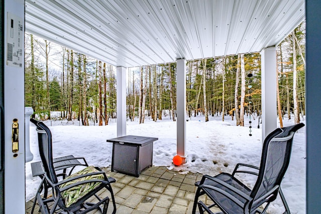 view of snow covered patio