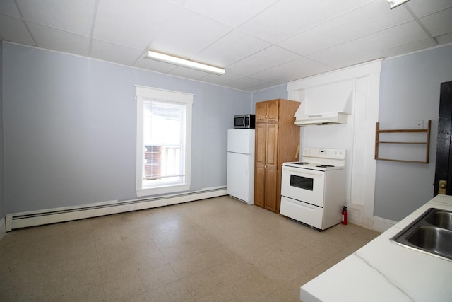 kitchen featuring light floors, light countertops, custom range hood, a baseboard heating unit, and white appliances